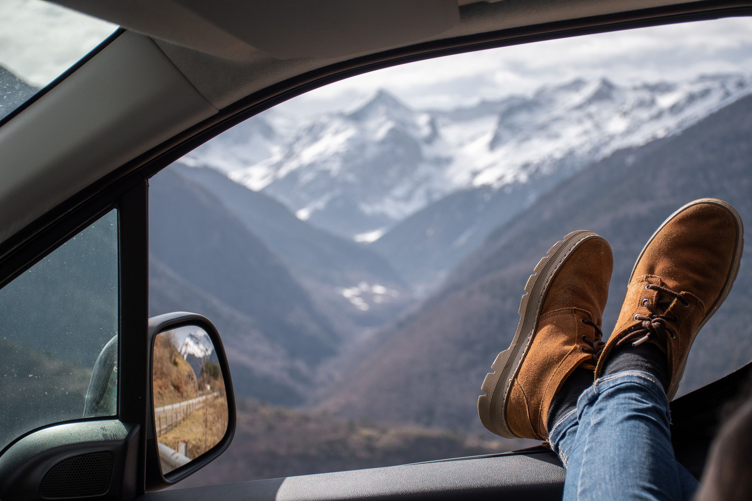 Woman Legs Resting On The Window Of A Van With Views