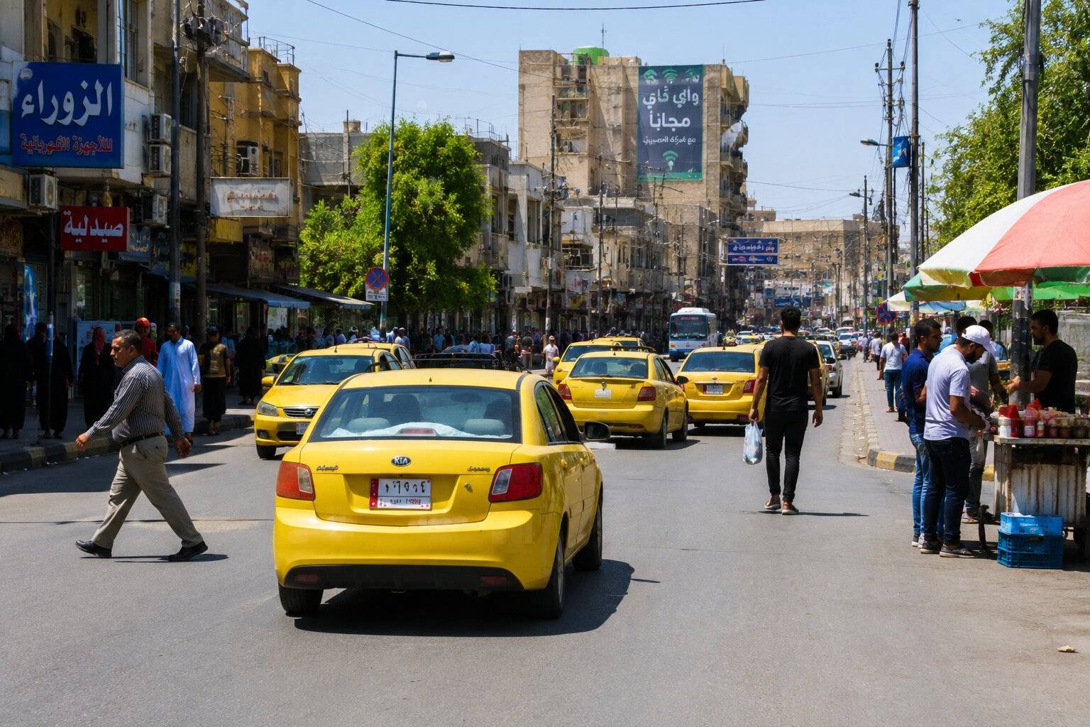 Yellow Taxis On A Busy Market Street In Baghdad